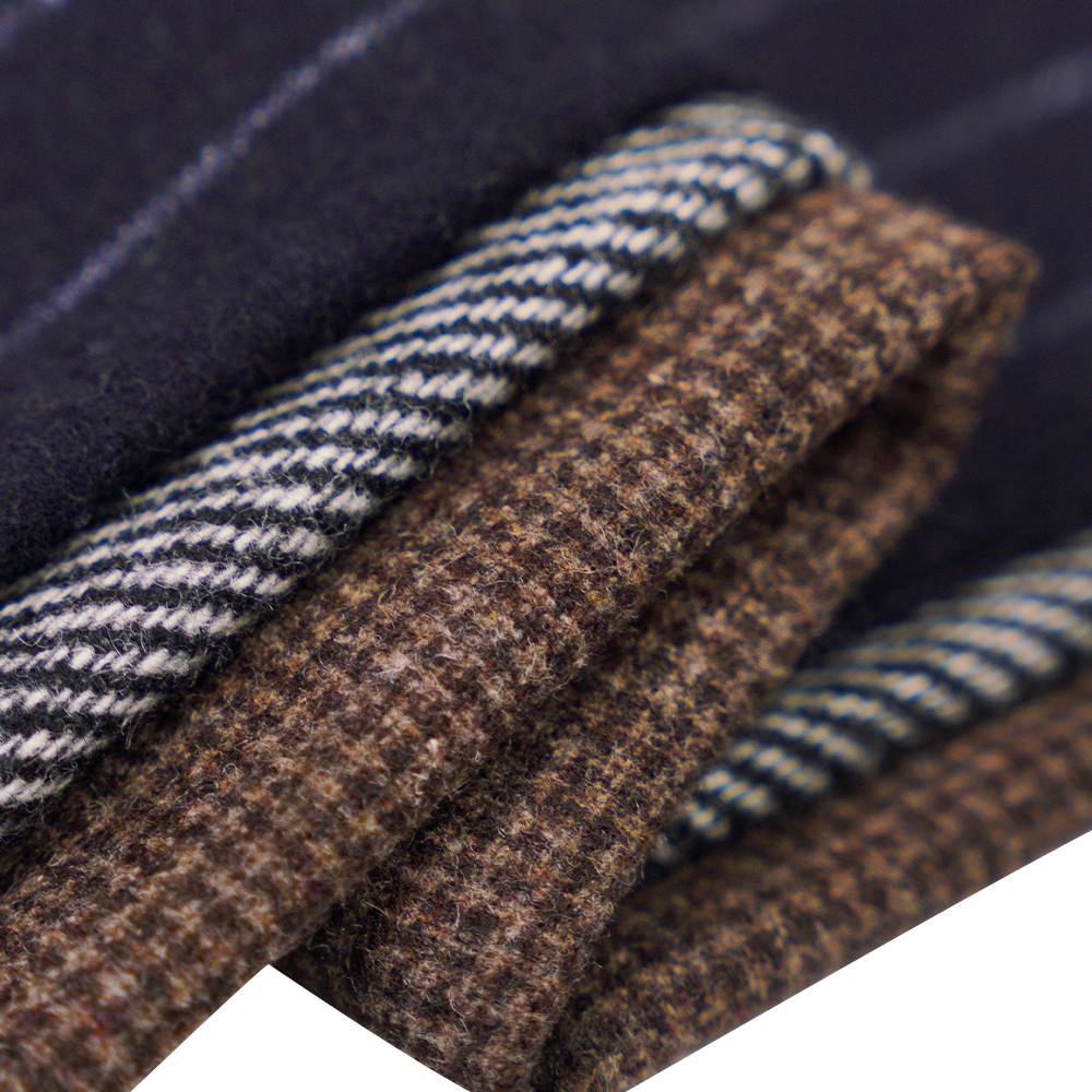 50% 羊毛、30% 涤纶、20% 其他纤维、320G/M、米白色 + 黑色、斜纹法兰绒面料、ML-C-22104